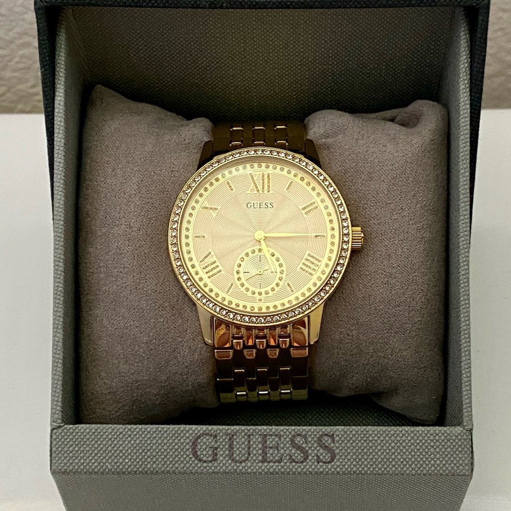 GUESS? GOLD PLATED, STAINLESS STEEL WATCH